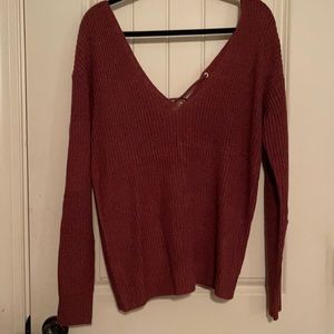 V-neck Maroon sweater.